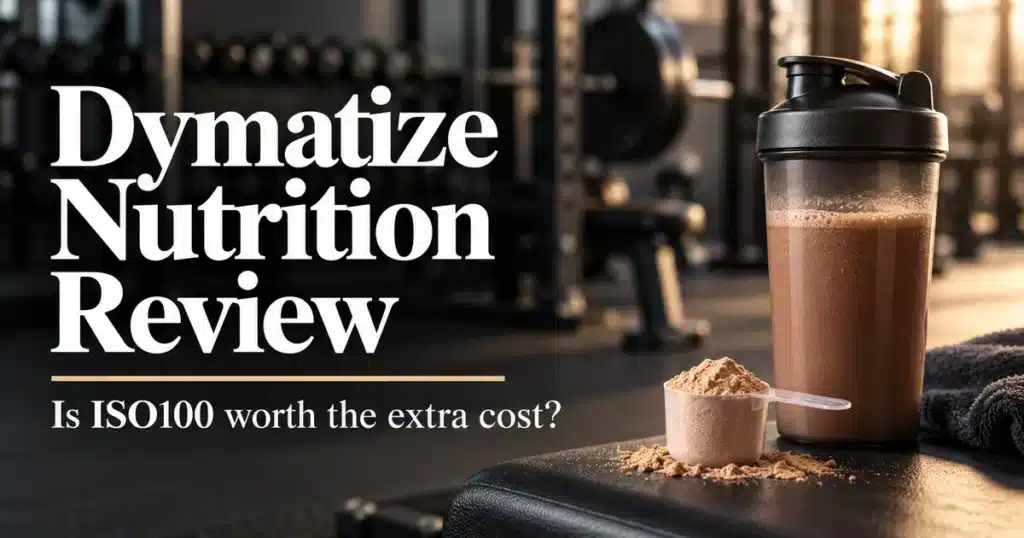 Dymatize nutrition review title beside a chocolate protein shake and powder scoop in a gym.